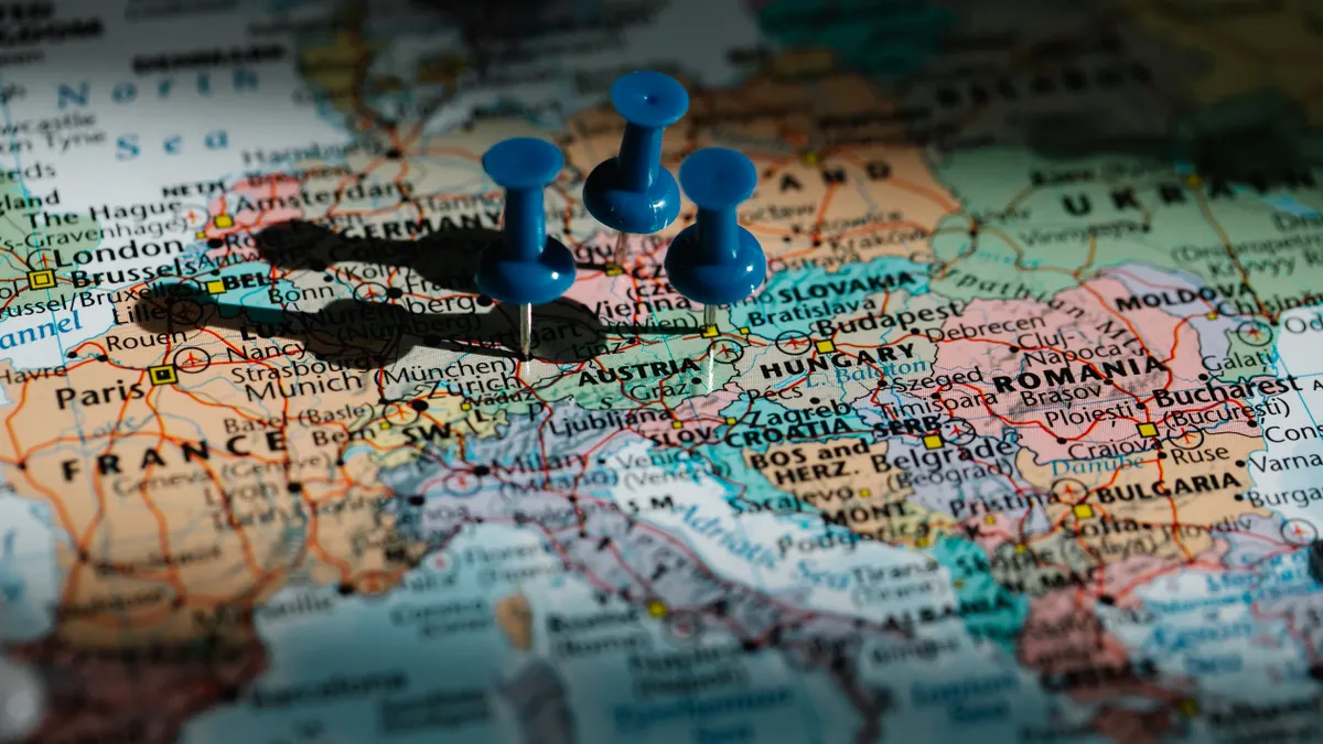 Push pins marking places on a map of Europe