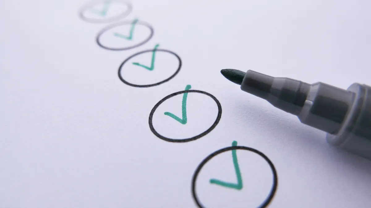 How to assign SEO tasks between AI and a human on a small business team Marked checklist with multiple checkmarks