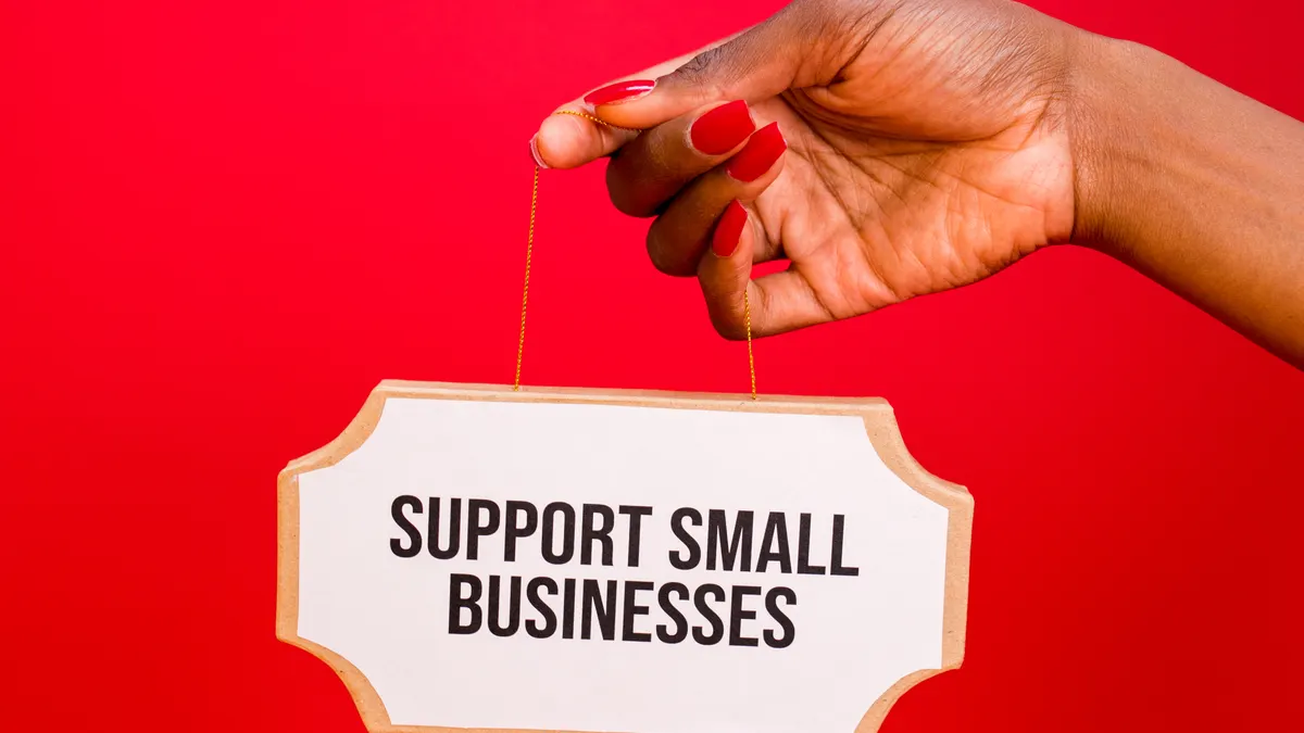 How to build local links for a small business — A Person Holding a Sign Board Support Small Business