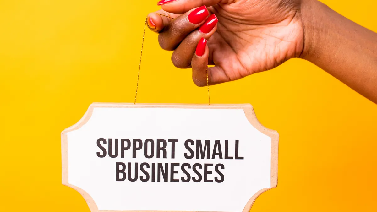 How to build local links for a small business — Woman Holding a Small Sign with a Text