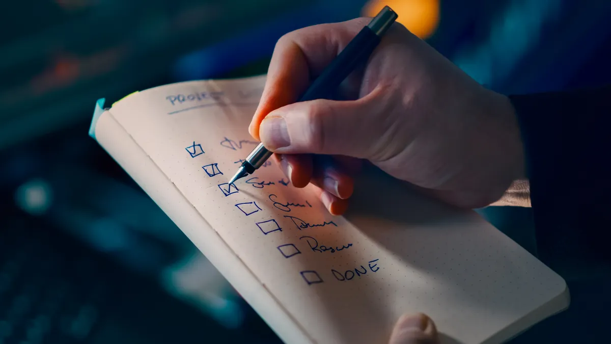 How to build SEO approval checkpoints for AI-written content Hand checking boxes on a notebook checklist
