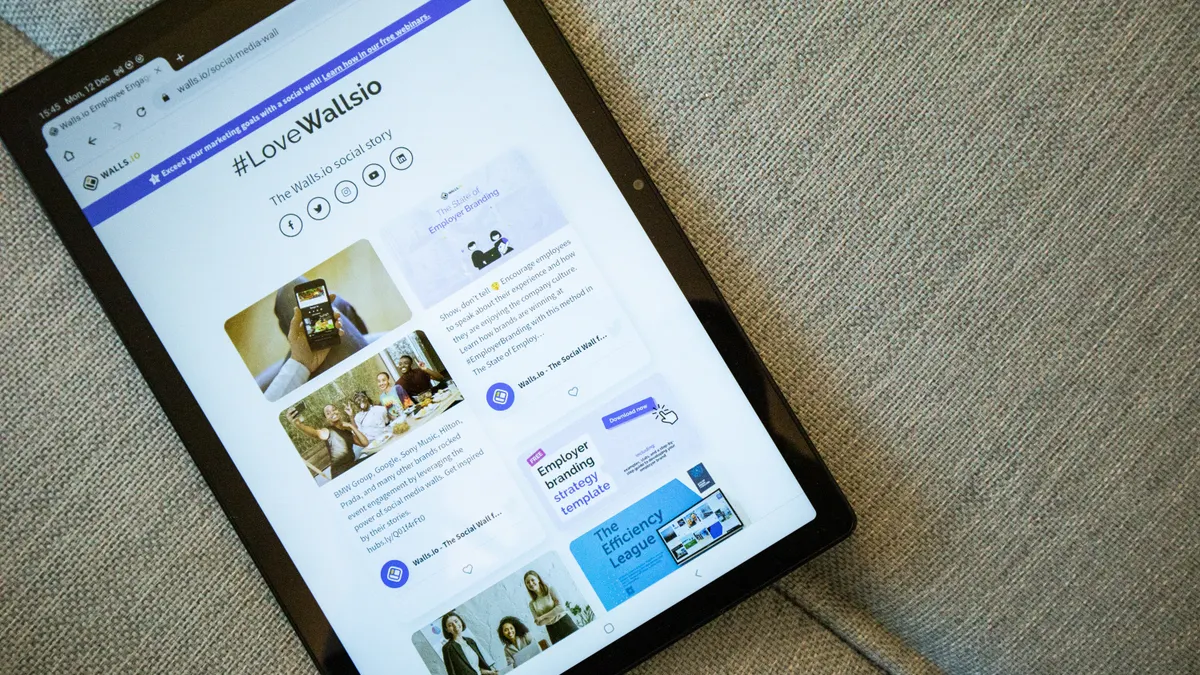 How to turn a small business website into an AI-friendly content structure How to turn a small business website into an AI-friendly content structure — Tablet Displaying Front Page of Walls.io We